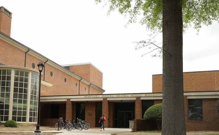 Front entrance of the Daniel Music Building at Furman University, featuring bicycles parked outside the entrance.